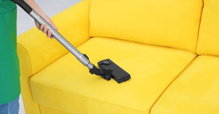 Technician providing vacuum tune-up service at Wimmers