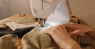 Sewing machine with maintenance tools, representing sewing machine maintenance tips