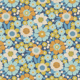 The Tilda Wallflower Lauren by 15-Brewer features a seamless pattern of large and small wallflower blooms in blue, orange, white, and yellow with green leaves on a dark blue background.