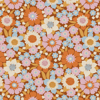 Seamless pattern of colorful orange, pink, blue, and white flowers with green leaves on brown, inspired by the Tilda Wallflower Lauren collection from 15-Brewer.