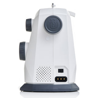 White and gray Husqvarna Viking Onyx 25 sewing machine by 38-SVP - Singer Viking Pfaff shown from the rear, featuring dials, ventilation holes, logo, power ports on the lower back panel, and an automatic one-step buttonhole.