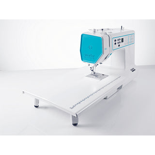The PFAFF Smarter By Pfaff 260c computerized sewing machine in white and turquoise features an extended flat work surface, displayed against a plain white background.