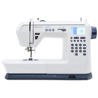 A Husqvarna Viking Onyx 30 computerized sewing machine from Imagine Sewing & Vacuum, featuring a digital display, control buttons, stitching area, and built-in thread cutter, is displayed on a plain background.