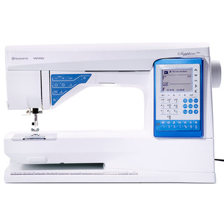The Husqvarna Viking Sapphire 930 is a computerized sewing machine in white and blue, featuring a digital display, multiple controls for settings, and an Automatic Thread Cutter for convenience.