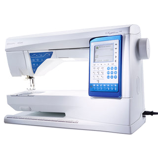 The Husqvarna Viking Sapphire 930 is a modern sewing machine with a digital display, control buttons, built-in ruler at the base, and EXCLUSIVE SENSOR SYSTEM Technology, shown plugged in.