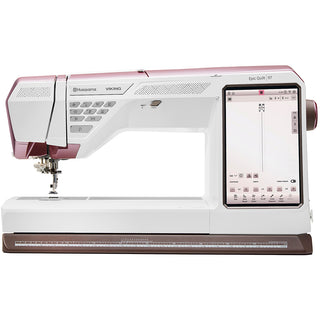 The Husqvarna Viking Epic Quilt 97 with Quilting Kit from Imagine Sewing & Vacuum features a large touch screen display and multiple function buttons.