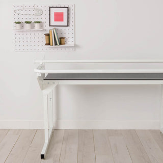 A Husqvarna Viking Platinum Q165 Moveable Quilter W/ 5' Frame with a black top and a shelf.