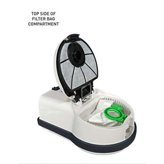 The open filter bag compartment of the 27-Sebo Airbelt D4 Premium White canister vacuum displays the filter bag and top cover with a circular filter. Text reads "TOP SIDE OF FILTER BAG COMPARTMENT.