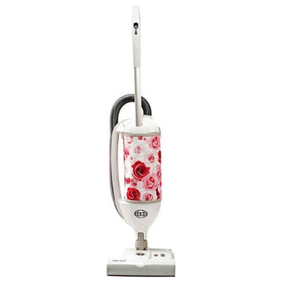 The 27-Sebo Felix Premium upright vacuum features a floral-patterned dust bag with red and pink roses, designed for stylish multi-surface cleaning, shown on a white background.