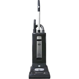 The Sew & Vac Sebo Automatic X4 Boost is a black upright vacuum cleaner with a silver control panel and white handle, featuring hospital-grade filtration, shown standing upright against a white background.