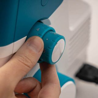 A person is using a PFAFF Admire Air 5000 sewing machine.