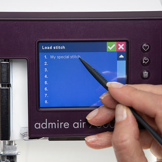 A person using a Pfaff Admire Air 7000 sewing machine.
