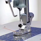 A Baby Lock Sashiko Specialty Machine on top of a piece of paper.