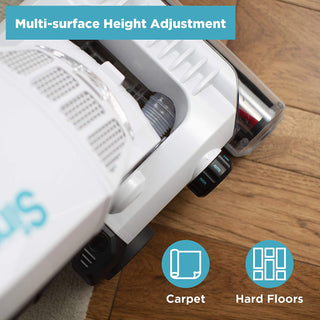 The Simplicity S20EZM Allergy Bagged Upright by simplicity features a HEPA vacuum head with multi-surface height adjustment, shown transitioning between carpet and hard floors, delivering powerful suction for a thorough clean.