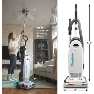 A woman uses the simplicity Simplicity S20EZM Allergy Bagged Upright vacuum with an extended attachment to clean a ceiling fan. The vacuum stands upright, measuring 44.5” tall by 12” wide, and features powerful suction for thorough cleaning.
