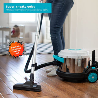A woman is cleaning the floor with a Simplicity BRIO Canister she bought online.