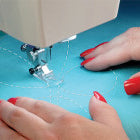 A woman is sewing on a Baby Lock Sashiko Specialty Machine.