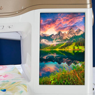 A Baby Lock Altair Sewing & Embroidery Machine with a picture of a mountain scene.