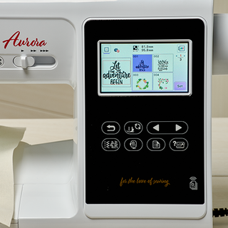 Close-up of the Baby Lock Aurora Embroidery and Sewing Machine's touchscreen, displaying a variety of design options such as "let adventure begin" and floral patterns. The machine, from the renowned Baby Lock brand, features 303 built-in embroidery designs and function buttons for different tasks.