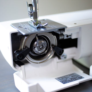 A Baby Lock Zest Sewing Machine on a table.