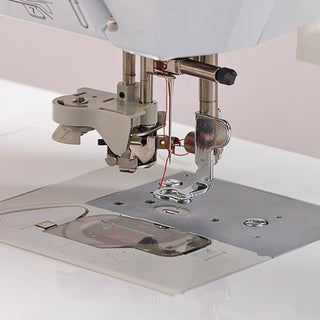 A Baby Lock sewing machine with a needle attached to it.