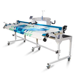 A Baby Lock Regalia Machine with a blue and white fabric on it.