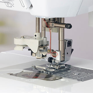 A Baby Lock Lyric Sewing & Quilting Machine with a needle attached to it.