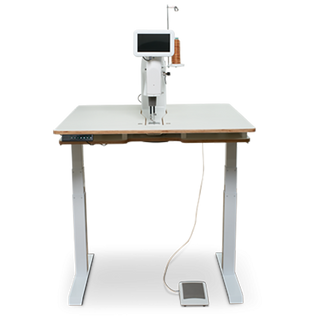 An industrial longarm quilting machine on a sturdy table with a pedal, isolated on a transparent background. - Baby Lock 20" Regalia Stationary Machine With Table And Insert from Baby Lock.