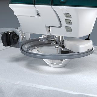 A PFAFF Creative Icon 2 - Purple Aurora sewing machine is sitting on a table.