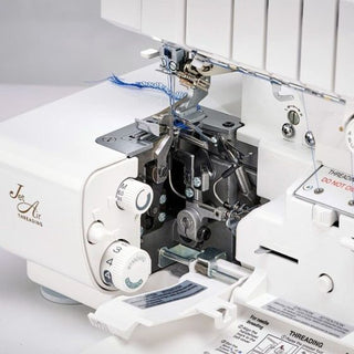 A Baby Lock Victory Serger with a needle and thread.