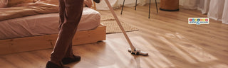 modern vacuum cleaner on hardwood flooring in bright living room