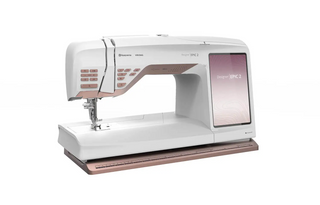 A white and pink sewing machine on a white background.