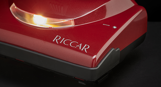 A red vacuum cleaner with the word rigar on it.