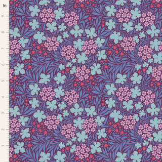 Tilda Hibernation AUTUMNBLOOM EGGPLANT TIL100524 Fabric by Tilda features clusters of blue and pink flowers with green leaves, autumn nature motifs, and a ruler on the left showing measurements in inches.