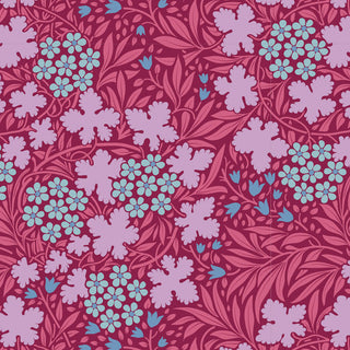 Elegant seamless floral pattern featuring light blue and lavender flowers, blue buds, and leafy vines on a reddish-pink background. Tilda Hibernation AUTUMNBLOOM OLD ROSE TIL100529 Fabric Yardage by Fabric by Tilda. Arts and Crafts inspired.