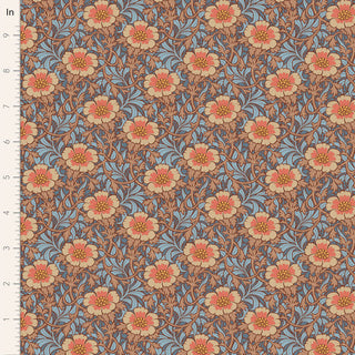 The Tilda Hibernation WINTERROSE HAZEL TIL100532 by Fabric by Tilda features a vintage-inspired floral pattern in orange, yellow, and blue on brown cotton—perfect for arts and crafts. Inch ruler on left shows scale.