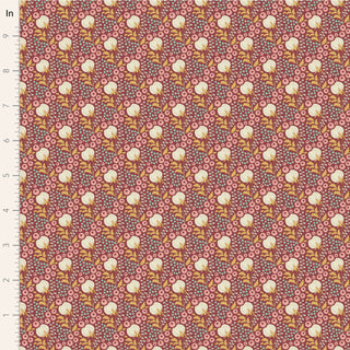 A close-up of Fabric by Tilda's Sanctuary COTTONFIELD MAROON TIL100564 shows repeating stylized yellow and white flowers on a pink background, with a ruler on the left in inches for scale.