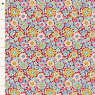 Tilda Wallflower Lauren Burgundy TIL100602 Fabric by Tilda features a colorful floral pattern with yellow, blue, pink, and white flowers on a burgundy 100% cotton background. An inch ruler on the left shows scale.