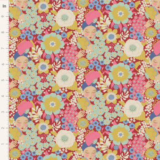Tilda Wallflower Burgundy TIL100606 Fabric by Tilda features a seamless floral pattern with large colorful flowers and illustrated faces with pink head wraps on a red background; ideal for quilting. Ruler on left shows inches.