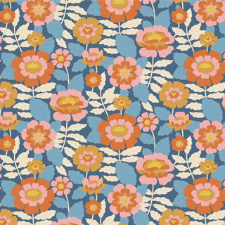 The 15-Brewer Tilda Wallflower Beverly features a seamless floral pattern with large pink, orange, and yellow flowers, cream leaves, and a blue background. Ideal for fabric projects; sold by the yard with uniform repeats.