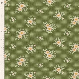 Tilda Merry Little Christmas 100634 Joy Pine Fabric by Tilda features green vintage fabric with small white polka dots and yellow and white floral clusters, shown with a ruler for scale—perfect for festive projects.