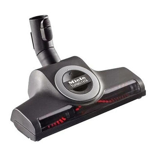 The 2-Miele STB 305-3 TurboTeQ Floorhead is a black vacuum cleaner attachment featuring red bristles visible through a transparent section—an essential accessory for powerful and efficient cleaning with your Miele vacuum.