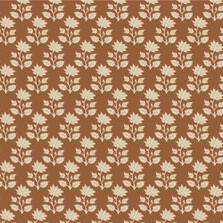 The Tilda Sanctuary Blender MIRA CARAMEL TIL110107 by Fabric by Tilda features repeating cream floral motifs on a brown background, ideal for quilts or any project requiring premium cotton fabric.