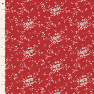 Tilda Merry Little Christmas 110139 Blender Noel Red Fabric by Fabric by Tilda features a red base with small blue flowers and white leaves, shown with an inch ruler for scale—perfect for festive projects.