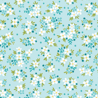 Garden Dalliance by Shelley Cavanna 17302-24 POSY AQUA Fabric Yardage from 74-Benartex features a pattern of small white and blue flowers with green leaves scattered across a light blue background, reminiscent of Regency-era English gardens. This evenly spaced, repeating design is perfect for fabric by the yard and ideal for creating projects with premium quilting cotton.