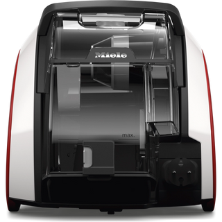 Back view of the 2-Miele Boost CX1 Pure Suction bagless canister vacuum cleaner, highlighting the clear dust container, power cord storage, and max fill line indicator on a sleek white and black body with red accents, featuring advanced Vortex technology for powerful cleaning performance.