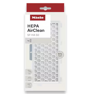 The Miele SF-HA 50-1 HEPA AirClean Filter - No TimeStrip, by 2-Miele, comes in white packaging with red accents and a clear window displaying the filter. The packaging highlights its 95% filtration efficiency, making it an essential accessory for your Miele vacuum.