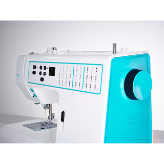 A close-up of the PFAFF Smarter By Pfaff 260c computerized sewing machine shows its turquoise side panel, multiple stitch options, and control buttons.