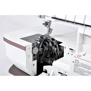 Close-up of an opened Husqvarna Viking Amber Air S400 Overlock Machine, highlighting detailed internal mechanisms, the one-touch air threading path, and a caution label.
