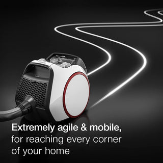 The 2-Miele Miele Boost CX1 Pure Suction, a compact bagless canister vacuum with a hose, is displayed on a dark surface with a white line highlighting its cleaning path. Promoted for its agility and mobility, this vacuum features powerful Vortex technology and an AirClean filter to deliver efficient dirt removal while keeping indoor air fresh.